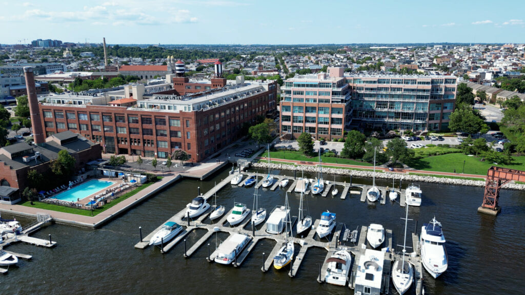 Aerial view of Canton Baltimore waterfront with boat slips and marina along the Patapsco River